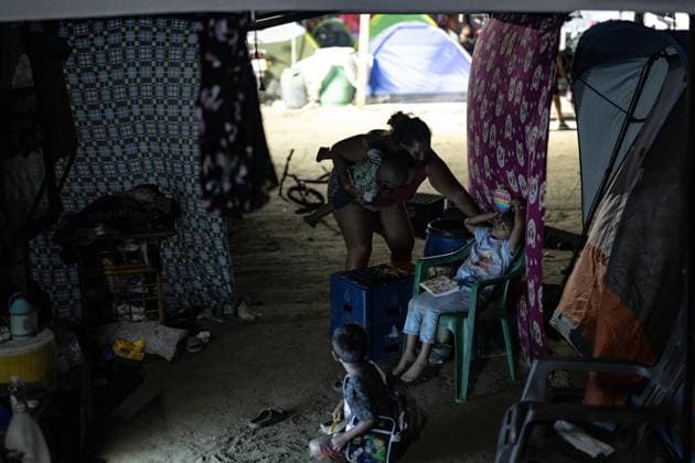 Earthquake survivors continue living in temporary shelters in La Guaira LA GUAIRA, VENEZUELA - JULY 10: A family takes shelter at a temporary camp after being displaced by the earthquakes in La Guaira, Venezuela, on July 10, 2026. Thousands of residents were forced to leave their homes after the powerful 7.2 and 7.5 magnitude earthquakes that struck Venezuela in succession on June 24 caused widespread destruction in the coastal city. Cem Tekkesinoglu Anadolu La Guaira Venezuela. Editorial use only. Please get in touch for any other usage.  Copyright: x2026xAnadoluxCemxTekkesinoglux