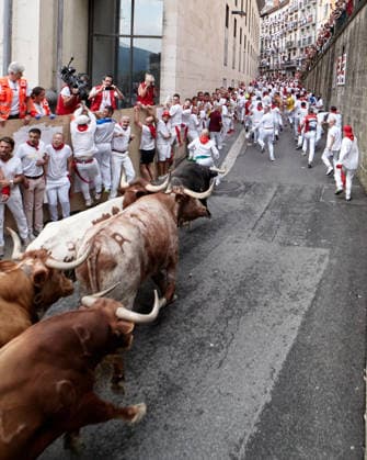 San Fermin Festival in Spain PAMPLONA, SPAIN - JULY 10: Participants take part in traditional rituals ahead of the fourth encierro, or bull run, of the world-renowned San Fermin Festival in Pamplona, Spain on July 10, 2026. Dressed in the festival’s traditional white clothing and red scarves, participants seek the protection of San Fermin before running along the 875-meter route through the city center. Ruben Albarran Anadolu Pamplona Spain. Editorial use only. Please get in touch for any other usage.  Copyright: x2026xAnadoluxRubenxAlbarranx