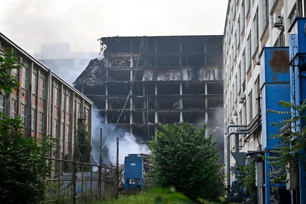 The situation following a fire at Building No. 34, an 11-story structure in the former Bata factory complex, on July 10, 2026, in Zlin, Czech Republic. A high-rise building in a former Bata shoe factory complex has been on fire on July 9, nobody was injured, but the property damage will be significant, as the building housed both warehouses and offices. (CTKxPhoto DaliborxGluck) CTKPhotoP2026071002393  CTKPhotoP2026071002393