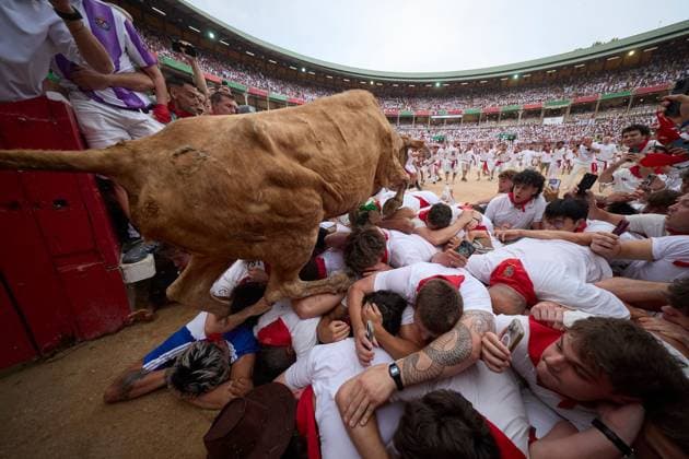 July 10, 2026, Pamplona, Spain: Participants wait by the bullpens gate for the release of a heifer during the vaquillas event following the fourth running of the bulls of the San FermiÂ­n festival in Pamplona, northern Spain. Pamplona Spain - ZUMAq101 20260710_zna_q101_039 Copyright: xUnaixBeroizx