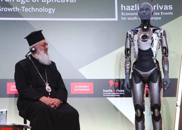 July 10, 2026, Athens, Greece: AMECA robot speaks with one philosopher and one preast at 30th Annual Government Roundtable Economist conference. Ameca is the worldÃ¢â‚¬â ¢s leading social humanoid robot, created by UK robotics company Engineered Arts. First unveiled in 2021, Ameca was designed for advanced, natural and engaging human-robot interaction, combining artificial intelligence, expressive and realistic facial movements, and lifelike gestures. Athens Greece  - ZUMAv62_ 20260710_zaf_v62_003 Copyright: xAristidisxVafeiadakisx