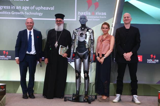 July 10, 2026, Athens, Greece: AMECA robot speaks with one philosopher and one preast at 30th Annual Government Roundtable Economist conference. Ameca is the worldÃ¢â‚¬â ¢s leading social humanoid robot, created by UK robotics company Engineered Arts. First unveiled in 2021, Ameca was designed for advanced, natural and engaging human-robot interaction, combining artificial intelligence, expressive and realistic facial movements, and lifelike gestures. Athens Greece - ZUMAv62_ 20260710_zaf_v62_012 Copyright: xAristidisxVafeiadakisx