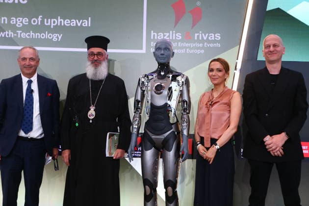 July 10, 2026, Athens, Greece: AMECA robot speaks with one philosopher and one preast at 30th Annual Government Roundtable Economist conference. Ameca is the worldÃ¢â‚¬â ¢s leading social humanoid robot, created by UK robotics company Engineered Arts. First unveiled in 2021, Ameca was designed for advanced, natural and engaging human-robot interaction, combining artificial intelligence, expressive and realistic facial movements, and lifelike gestures. Athens Greece - ZUMAv62_ 20260710_zaf_v62_013 Copyright: xAristidisxVafeiadakisx
