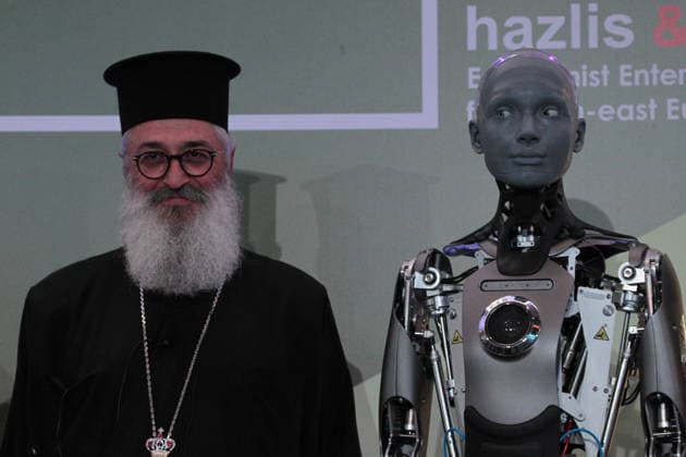 July 10, 2026, Athens, Greece: AMECA robot speaks with one philosopher and one preast at 30th Annual Government Roundtable Economist conference. Ameca is the worldÃ¢â‚¬â ¢s leading social humanoid robot, created by UK robotics company Engineered Arts. First unveiled in 2021, Ameca was designed for advanced, natural and engaging human-robot interaction, combining artificial intelligence, expressive and realistic facial movements, and lifelike gestures. Athens Greece  - ZUMAv62_ 20260710_zaf_v62_033 Copyright: xAristidisxVafeiadakisx