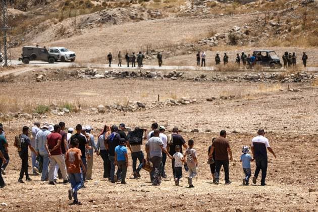 Israeli settlers prevented Palestinian farmers from accessing their agricultural lands in Hebron HEBRON, WEST BANK, PALESTINE - JULY 10: Palestinians are seen after performing Friday prayers on land threatened with confiscation by Israel while Israeli settlers, protected by Israeli forces, continue to block roads leading to Palestinian farmers lands in the town of Izna, near Hebron, West Bank, Palestine on July 10, 2026. Wisam Hashlamoun Anadolu Hebron West Bank. Editorial use only. Please get in touch for any other usage.  Copyright: x2026xAnadoluxWisamxHashlamounx