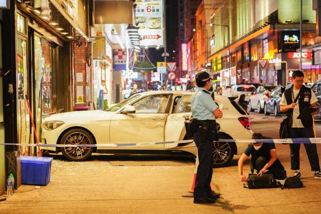 HONG KONG-DAILY MONGKOK-CAR-CRASH A general view from outside the police cordon shows a white private car that crashed into a cafe at the intersection of Portland Street and Shantung Street following a police chase in Mong Kok on July 10, 2026 in Hong Kong. Police arrested two men and seized suspected drugs from the vehicle after it rammed onto the pavement while evading an intercept. (Photo by Zulu Lo TMHK via Nexpher Images) Hong Kong
