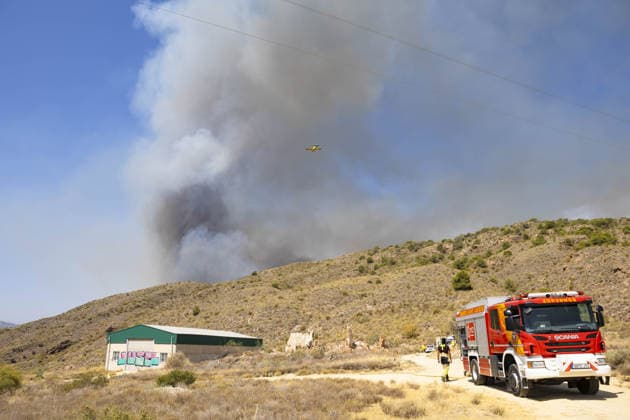 Forest fire kills at least 12 in southern Spain ALMERIA, SPAIN - JULY 10: Black smoke rise from the forest fire while evacuation and firefighting efforts continue in the Los Gallardos district of Almeria, Spain on July 10, 2026. At least 12 people were killed in a forest fire that broke out Thursday in Los Gallardos municipality in Almeria province in Spain’s southern Andalusia region, broadcaster RTVE reported. According to Andalusia’s emergency services, the victims were found in a hamlet of the neighboring municipality of Bedar, with some discovered inside vehicles engulfed by the flames. Chema Artero Anadolu Almeria Spain. Editorial use only. Please get in touch for any other usage.  Copyright: x2026xAnadoluxChemaxArterox