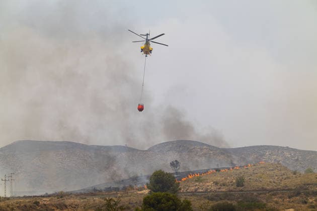 Forest fire kills at least 12 in southern Spain ALMERIA, SPAIN - JULY 10: A firefighting helicopter is carrying water to respond to the fire as evacuation and forest fire extinguishing operations are ongoing in the Los Gallardos district of Almeria, Spain on July 10, 2026. At least 12 people were killed in a forest fire that broke out Thursday in Los Gallardos municipality in Almeria province in Spain’s southern Andalusia region, broadcaster RTVE reported. According to Andalusia’s emergency services, the victims were found in a hamlet of the neighboring municipality of Bedar, with some discovered inside vehicles engulfed by the flames. Chema Artero Anadolu Almeria Spain. Editorial use only. Please get in touch for any other usage.  Copyright: x2026xAnadoluxChemaxArterox