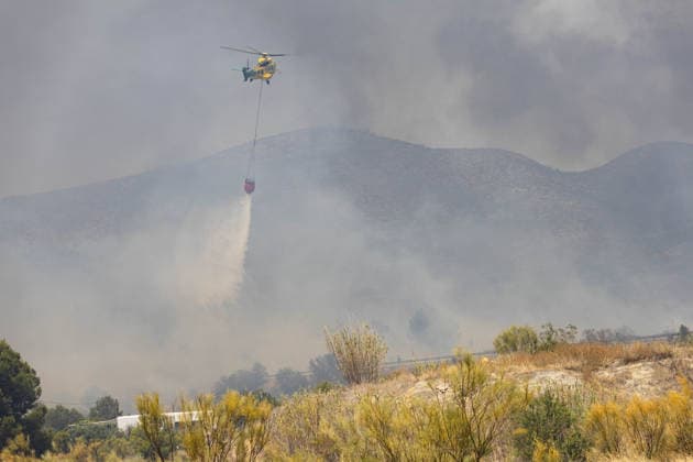 Forest fire kills at least 12 in southern Spain ALMERIA, SPAIN - JULY 10: A firefighting helicopter drops water while responding to a fire as evacuation and forest fire extinguishing operations are ongoing in the Los Gallardos district of Almeria, Spain on July 10, 2026. At least 12 people were killed in a forest fire that broke out Thursday in Los Gallardos municipality in Almeria province in Spain’s southern Andalusia region, broadcaster RTVE reported. According to Andalusia’s emergency services, the victims were found in a hamlet of the neighboring municipality of Bedar, with some discovered inside vehicles engulfed by the flames. Chema Artero Anadolu Almeria Spain. Editorial use only. Please get in touch for any other usage.  Copyright: x2026xAnadoluxChemaxArterox