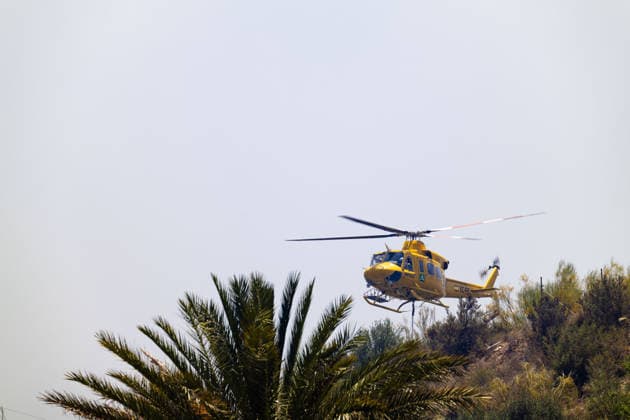 Forest fire kills at least 12 in southern Spain ALMERIA, SPAIN - JULY 10: A firefighting helicopter is carrying water to respond to the fire as evacuation and forest fire extinguishing operations are ongoing in the Los Gallardos district of Almeria, Spain on July 10, 2026. At least 12 people were killed in a forest fire that broke out Thursday in Los Gallardos municipality in Almeria province in Spain’s southern Andalusia region, broadcaster RTVE reported. According to Andalusia’s emergency services, the victims were found in a hamlet of the neighboring municipality of Bedar, with some discovered inside vehicles engulfed by the flames. Chema Artero Anadolu Almeria Spain. Editorial use only. Please get in touch for any other usage.  Copyright: x2026xAnadoluxChemaxArterox