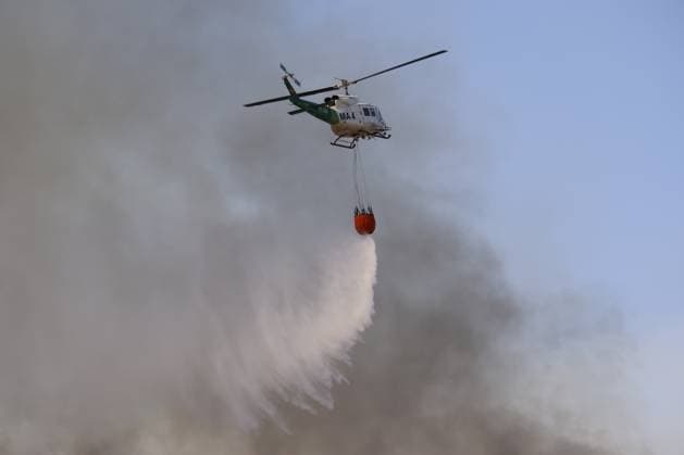 Forest fire kills at least 12 in southern Spain ALMERIA, SPAIN - JULY 10: A firefighting helicopter drops water onto a thick column of smoke to combat a massive wildfire while evacuation and firefighting efforts continue in the Los Gallardos district of Almeria, Spain on July 10, 2026. At least 12 people were killed in a forest fire that broke out Thursday in Los Gallardos municipality in Almeria province in Spain’s southern Andalusia region, broadcaster RTVE reported. According to Andalusia’s emergency services, the victims were found in a hamlet of the neighboring municipality of Bedar, with some discovered inside vehicles engulfed by the flames. Pablo Miranzo Anadolu Almeria Spain. Editorial use only. Please get in touch for any other  Copyright: x2026xAnadoluxPabloxMiranzox