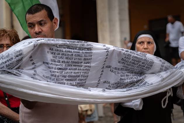 ITALY-GAZA PROTEST CESENA, ITALY, JULY 10, 2026 Participants march beneath a giant white shroud covered with the names of 18,457 Palestinian children killed in Gaza since October 2023 during the Shroud for Gaza demonstration in Cesena, northern Italy. The memorial installation is part of a travelling national initiative that has crossed several Italian cities to honour the victims of the war and draw attention to the humanitarian consequences of the conflict. (Silvia Casadei JNA Press) Cesena Italy Copyright: x xSilviaxCasadeix xJNAxPressx