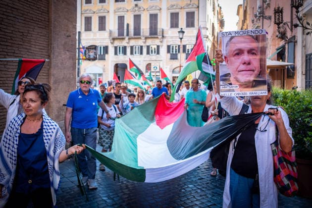 July 10, 2026, Rome, Rm, Italy: Activists from the group Health Workers for Gaza are holding a rally in front of Montecitorio, the Chamber of Deputies, to demand the release of Dr. Hussam Abu Safiya and all other Palestinian prisoners. Participants arrive in front of Montecitorio showing an image of Dr. Abu Safiya. Rome Italy - ZUMAg256 20260710_znp_g256_004 Copyright: xMarcoxDixGianvitox