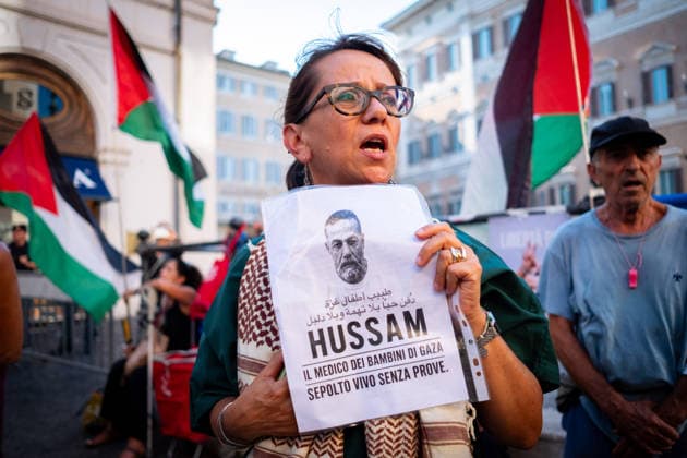 July 10, 2026, Rome, Rm, Italy: Activists from the group Health Workers for Gaza are holding a rally in front of Montecitorio, the Chamber of Deputies, to demand the release of Dr. Hussam Abu Safiya and all other Palestinian prisoners. A participant shows the picture of Dr. Abu Safiya. Rome Italy - ZUMAg256 20260710_znp_g256_017 Copyright: xMarcoxDixGianvitox