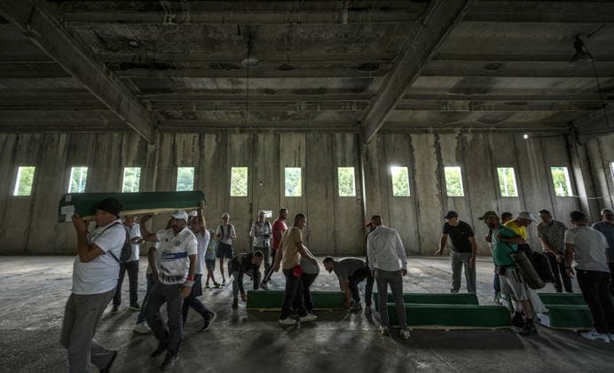 Coffins brought to Musalla in Potocari: The last farewell to the victims of the genocide in Srebrenica SREBRENICA, BOSNIA AND HERZEGOVINA - JULY 10: Family members of the victims and Peace March participants carry coffins containing the remains of ten Srebrenica genocide victims from the former Battery Factory to the Musalla area at the Potocari Memorial Center Cemetery in Srebrenica, Bosnia and Herzegovina, on July 10, 2026. Relatives and participants gathered with prayers and tears ahead of tomorrow s collective funeral and burial on the 31st anniversary of the 1995 genocide. Samir Jordamovic Anadolu Srebrenica Bosnia and Herzegovina. Editorial use only. Please get in touch for any other usage.  Copyright: x2026xAnadoluxSamirxJordamovicx