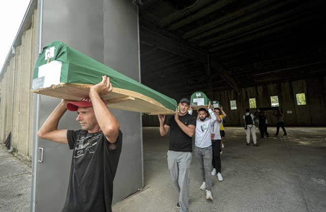 Coffins brought to Musalla in Potocari: The last farewell to the victims of the genocide in Srebrenica SREBRENICA, BOSNIA AND HERZEGOVINA - JULY 10: Family members of the victims and Peace March participants carry coffins containing the remains of ten Srebrenica genocide victims from the former Battery Factory to the Musalla area at the Potocari Memorial Center Cemetery in Srebrenica, Bosnia and Herzegovina, on July 10, 2026. Relatives and participants gathered with prayers and tears ahead of tomorrow s collective funeral and burial on the 31st anniversary of the 1995 genocide. Samir Jordamovic Anadolu Srebrenica Bosnia and Herzegovina. Editorial use only. Please get in touch for any other usage.  Copyright: x2026xAnadoluxSamirxJordamovicx