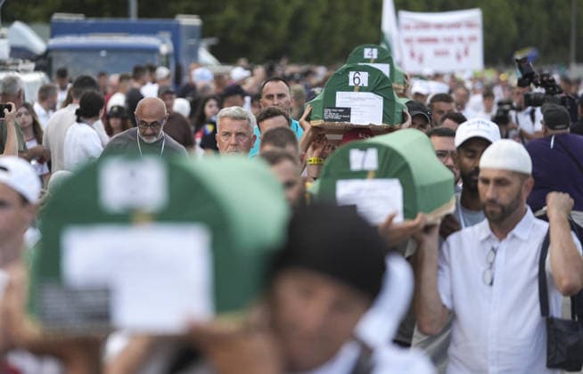 Coffins brought to Musalla in Potocari: The last farewell to the victims of the genocide in Srebrenica SREBRENICA, BOSNIA AND HERZEGOVINA - JULY 10: Family members of the victims and Peace March participants carry coffins containing the remains of ten Srebrenica genocide victims from the former Battery Factory to the Musalla area at the Potocari Memorial Center Cemetery in Srebrenica, Bosnia and Herzegovina, on July 10, 2026. Relatives and participants gathered with prayers and tears ahead of tomorrow s collective funeral and burial on the 31st anniversary of the 1995 genocide. Samir Jordamovic Anadolu Srebrenica Bosnia and Herzegovina. Editorial use only. Please get in touch for any other usage.  Copyright: x2026xAnadoluxSamirxJordamovicx