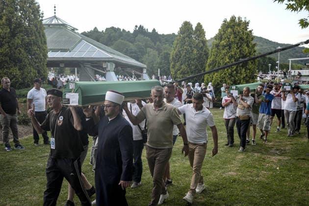 Coffins brought to Musalla in Potocari: The last farewell to the victims of the genocide in Srebrenica SREBRENICA, BOSNIA AND HERZEGOVINA - JULY 10: Family members of the victims and Peace March participants carry coffins containing the remains of ten Srebrenica genocide victims from the former Battery Factory to the Musalla area at the Potocari Memorial Center Cemetery in Srebrenica, Bosnia and Herzegovina, on July 10, 2026. Relatives and participants gathered with prayers and tears ahead of tomorrow s collective funeral and burial on the 31st anniversary of the 1995 genocide. Samir Jordamovic Anadolu Srebrenica Bosnia and Herzegovina. Editorial use only. Please get in touch for any other usage.  Copyright: x2026xAnadoluxSamirxJordamovicx