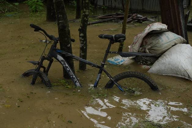 July 10, 2026, Banshkhali, Bangladesh: BANSHKHALI, CHATTOGRAM, BANGLADESH Ã¢â‚¬ JULY 10, 2026: Residents wade through floodwaters and evacuate children and belongings after days of heavy monsoon rainfall, runoff from surrounding hills and high tides caused severe flooding in Banshkhali Upazila, Chattogram. Hundreds of homes, roads and agricultural land have been inundated, leaving many families stranded and increasing concerns over access to shelter, clean water and essential services. Authorities and local volunteers continue to monitor the situation as affected residents wait for floodwaters to recede. Photos by JNA PRESS. Banshkhali Bangladesh  - ZUMAq101 20260710_zna_q101_066 Copyright: xIstiyakxAhamedxSrabonx