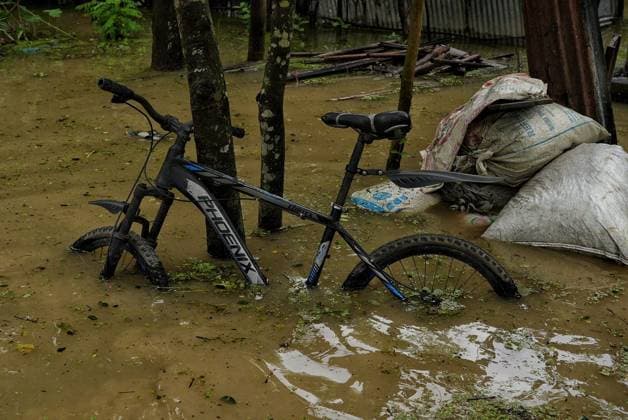July 10, 2026, Banshkhali, Bangladesh: BANSHKHALI, CHATTOGRAM, BANGLADESH Ã¢â‚¬ JULY 10, 2026: Residents wade through floodwaters and evacuate children and belongings after days of heavy monsoon rainfall, runoff from surrounding hills and high tides caused severe flooding in Banshkhali Upazila, Chattogram. Hundreds of homes, roads and agricultural land have been inundated, leaving many families stranded and increasing concerns over access to shelter, clean water and essential services. Authorities and local volunteers continue to monitor the situation as affected residents wait for floodwaters to recede. Photos by JNA PRESS. Banshkhali Bangladesh  - ZUMAq101 20260710_zna_q101_068 Copyright: xIstiyakxAhamedxSrabonx
