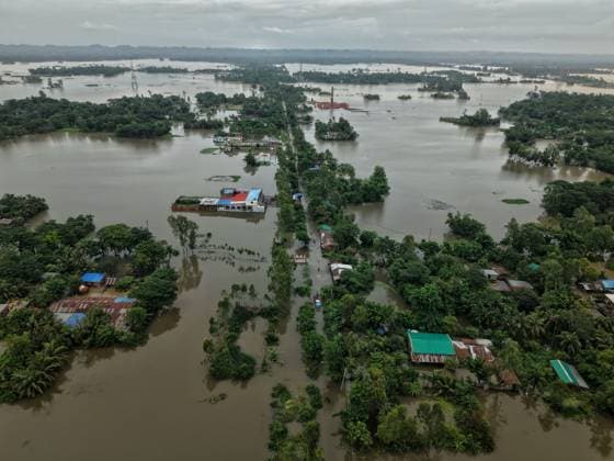 July 10, 2026, Banshkhali, Bangladesh: BANSHKHALI, CHATTOGRAM, BANGLADESH Ã¢â‚¬ JULY 10, 2026: Residents wade through floodwaters and evacuate children and belongings after days of heavy monsoon rainfall, runoff from surrounding hills and high tides caused severe flooding in Banshkhali Upazila, Chattogram. Hundreds of homes, roads and agricultural land have been inundated, leaving many families stranded and increasing concerns over access to shelter, clean water and essential services. Authorities and local volunteers continue to monitor the situation as affected residents wait for floodwaters to recede. Photos by JNA PRESS. Banshkhali Bangladesh  - ZUMAq101 20260710_zna_q101_070 Copyright: xIstiyakxAhamedxSrabonx