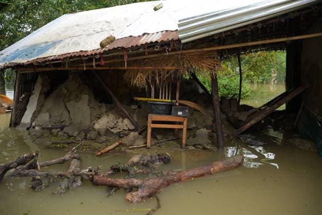 July 10, 2026, Banshkhali, Bangladesh: BANSHKHALI, CHATTOGRAM, BANGLADESH Ã¢â‚¬ JULY 10, 2026: Residents wade through floodwaters and evacuate children and belongings after days of heavy monsoon rainfall, runoff from surrounding hills and high tides caused severe flooding in Banshkhali Upazila, Chattogram. Hundreds of homes, roads and agricultural land have been inundated, leaving many families stranded and increasing concerns over access to shelter, clean water and essential services. Authorities and local volunteers continue to monitor the situation as affected residents wait for floodwaters to recede. Photos by JNA PRESS. Banshkhali Bangladesh  - ZUMAq101 20260710_zna_q101_072 Copyright: xIstiyakxAhamedxSrabonx