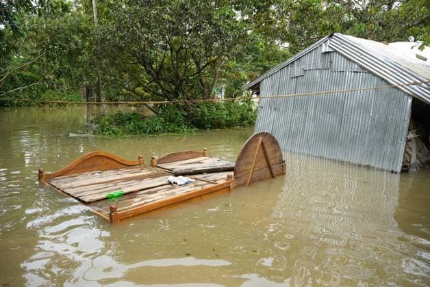 July 10, 2026, Banshkhali, Bangladesh: BANSHKHALI, CHATTOGRAM, BANGLADESH Ã¢â‚¬ JULY 10, 2026: Residents wade through floodwaters and evacuate children and belongings after days of heavy monsoon rainfall, runoff from surrounding hills and high tides caused severe flooding in Banshkhali Upazila, Chattogram. Hundreds of homes, roads and agricultural land have been inundated, leaving many families stranded and increasing concerns over access to shelter, clean water and essential services. Authorities and local volunteers continue to monitor the situation as affected residents wait for floodwaters to recede. Photos by JNA PRESS. Banshkhali Bangladesh  - ZUMAq101 20260710_zna_q101_079 Copyright: xIstiyakxAhamedxSrabonx
