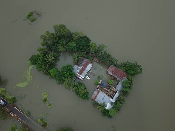 July 10, 2026, Banshkhali, Bangladesh: BANSHKHALI, CHATTOGRAM, BANGLADESH Ã¢â‚¬ JULY 10, 2026: Residents wade through floodwaters and evacuate children and belongings after days of heavy monsoon rainfall, runoff from surrounding hills and high tides caused severe flooding in Banshkhali Upazila, Chattogram. Hundreds of homes, roads and agricultural land have been inundated, leaving many families stranded and increasing concerns over access to shelter, clean water and essential services. Authorities and local volunteers continue to monitor the situation as affected residents wait for floodwaters to recede. Photos by JNA PRESS. Banshkhali Bangladesh  - ZUMAq101 20260710_zna_q101_085 Copyright: xIstiyakxAhamedxSrabonx