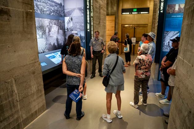 Visitors listen to a National Park Service Ranger in the newly-remodeled undercroft beneath the Lincoln Memorial in Washington, DC on Friday, July 10, 2026. The new 15,000-square-foot exhibit showcases the massive concrete foundations that support the memorial while telling the story of how the Lincoln Memorial was designed and built.  WAP20260710330 BONNIExCASH