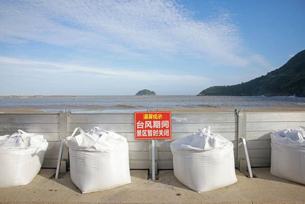 WENZHOU, CHINA - JULY 10: A general view shows the closed Jinsha Beach scenic area as typhoon Bavi approaches on July 10, 2026 in Cangnan, Zhejiang Province of China. Local authorities have suspended operations at the beach while reinforcing coastal defenses with a modular sea wall designed to withstand wave impact.  Copyright: xChinaxNewsxServicex 111653534214