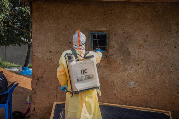 (260711) -- KINSHASA, July 11, 2026 -- A medical worker performs disinfection before burying a deceased person infected with the Ebola virus in Bunia, the capital of Ituri Province in the Democratic Republic of the Congo, July 9, 2026. The Ebola outbreak in the Democratic Republic of the Congo (DRC) remains in a very active phase and has yet to peak, health authorities said Thursday. DR CONGO-BUNIA-EBOLA OUTBREAK-EPIDEMIC CONTROL XinxHuashefa 
