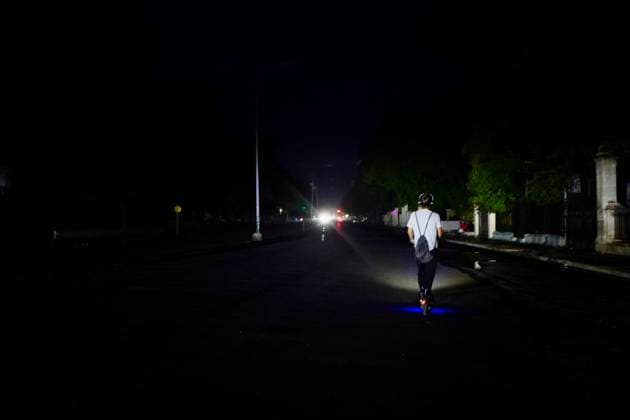 (260711) -- HAVANA, July 11, 2026 -- A man rides an electric scooter on a street during a blackout in Havana, Cuba, July 10, 2026. Cuba was hit by another nationwide blackout on Friday, as the country s power system completely collapsed at 4:30 p.m. local time, according to the National Electric Union. ) CUBA-HAVANA-NATIONAL BLACKOUT-STREET VIEWS JiangxBiao 