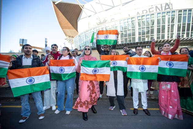 NARENDRA MODI NEW ZEALAND VISIT, People hold Indian flags during Indian Prime Minister Narendra Modi™s visit to the Kia Ora Modi community reception at Spark Arena in Auckland, New Zealand, Saturday, July 11, 2026. ( NO ARCHIVING Auckland Auckland New Zealand  Copyright: xChrisxMcKeenx 20260711174311754094
