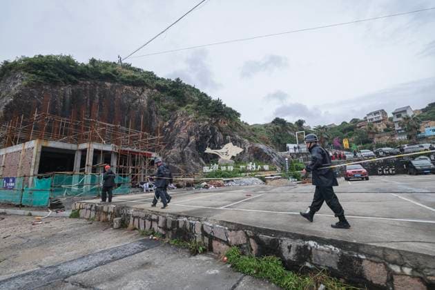 (260711) -- WENLING, July 11, 2026 -- Local officials set up security cordons on the seaside to prevent people from entering dangerous areas in Shitang Town of Wenling City, east China s Zhejiang Province, July 11, 2026. Typhoon Bavi, the ninth typhoon of the year, is expected to make landfall along the coast between Sanmen and Cangnan in east China s Zhejiang Province in the early hours of Sunday. In preparation, authorities at all levels in Wenling have stepped up with extra hands on duty as well as reinforced safety and prevention measures. Local emergency teams, shelters, and supplies are now fully prepared for typhoon response. ) CHINA-ZHEJIANG-WENLING-TYPHOON BAVI-PREVENTION (CN) XuxYu 