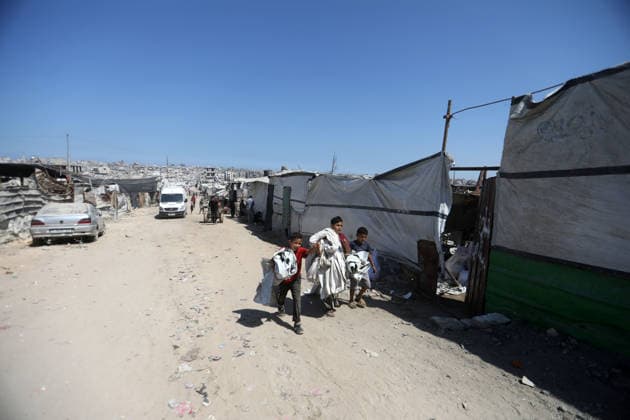 Displaced Palestinians endure harsh living conditions in eastern Gaza City Displaced Palestinians struggle to continue their daily lives inside worn-out tents erected near buildings destroyed by the war in the al-Zarqa area, east of Gaza City, on July 11, 2026. The scene coincides with World Population Day as displaced families continue to face shortages of water and food, deteriorating sanitation and healthcare services, and the widespread collapse of essential infrastructure amid the ongoing impact of the war. Photo by Bilal Osama apaimages Gaza city Gaza Strip Palestinian Territory 110726_Gaza_BO_00(52) Copyright: xapaimagesxBilalxOsamax xapaimagesx