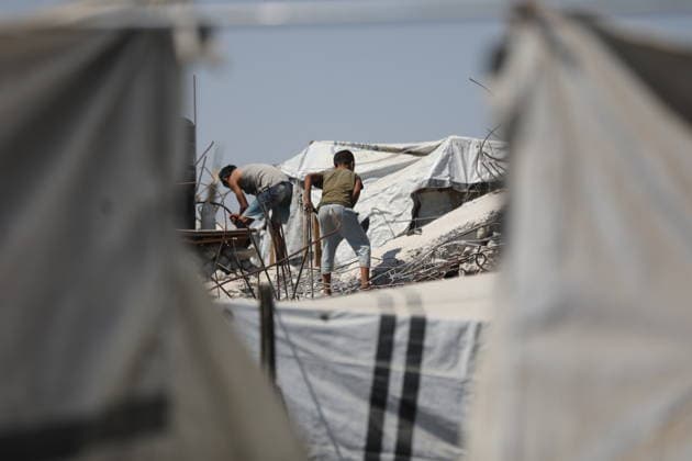 Displaced Palestinians endure harsh living conditions in eastern Gaza City Displaced Palestinians struggle to continue their daily lives inside worn-out tents erected near buildings destroyed by the war in the al-Zarqa area, east of Gaza City, on July 11, 2026. The scene coincides with World Population Day as displaced families continue to face shortages of water and food, deteriorating sanitation and healthcare services, and the widespread collapse of essential infrastructure amid the ongoing impact of the war. Photo by Bilal Osama apaimages Gaza city Gaza Strip Palestinian Territory 110726_Gaza_BO_00(55) Copyright: xapaimagesxBilalxOsamax xapaimagesx