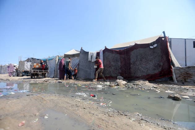 Displaced Palestinians endure harsh living conditions in eastern Gaza City Displaced Palestinians struggle to continue their daily lives inside worn-out tents erected near buildings destroyed by the war in the al-Zarqa area, east of Gaza City, on July 11, 2026. The scene coincides with World Population Day as displaced families continue to face shortages of water and food, deteriorating sanitation and healthcare services, and the widespread collapse of essential infrastructure amid the ongoing impact of the war. Photo by Bilal Osama apaimages Gaza city Gaza Strip Palestinian Territory 110726_Gaza_BO_00(11) Copyright: xapaimagesxBilalxOsamax xapaimagesx