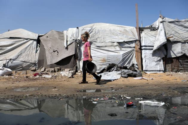 Displaced Palestinians endure harsh living conditions in eastern Gaza City Displaced Palestinians struggle to continue their daily lives inside worn-out tents erected near buildings destroyed by the war in the al-Zarqa area, east of Gaza City, on July 11, 2026. The scene coincides with World Population Day as displaced families continue to face shortages of water and food, deteriorating sanitation and healthcare services, and the widespread collapse of essential infrastructure amid the ongoing impact of the war. Photo by Bilal Osama apaimages Gaza city Gaza Strip Palestinian Territory 110726_Gaza_BO_00(13) Copyright: xapaimagesxBilalxOsamax xapaimagesx