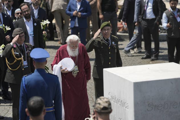 Thousands gather in Srebrenica to mark 31st anniversary of genocide as 10 more victims laid to rest POTOCARI, BOSNIA AND HERZEGOVINA – JULY 11: Clergy members and military representatives pay tribute at the memorial monument during a ceremony marking the 31st anniversary of the 1995 Srebrenica genocide at the Potocari Memorial Cemetery during a ceremony marking the 31st anniversary of the 1995 Srebrenica genocide in Potocari, Bosnia and Herzegovina, on July 11, 2026. The commemoration, attended by thousands of mourners, survivors, foreign dignitaries and religious leaders, coincided with the collective funeral of 10 newly identified genocide victims. The genocide, carried out by Bosnian Serb forces, claimed the lives of more than 8,000 Bosn  Copyright: x2026xAnadoluxSamirxJordamovicx