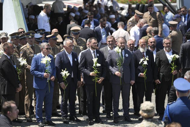Thousands gather in Srebrenica to mark 31st anniversary of genocide as 10 more victims laid to rest POTOCARI, BOSNIA AND HERZEGOVINA – JULY 11: Delegations lay flowers at the memorial monument at the entrance of the Potocari Memorial Cemetery during a ceremony marking the 31st anniversary of the 1995 Srebrenica genocide in Potocari, Bosnia and Herzegovina, on July 11, 2026. The commemoration, attended by thousands of mourners, survivors, foreign dignitaries and religious leaders, coincided with the collective funeral of 10 newly identified genocide victims. The genocide, carried out by Bosnian Serb forces, claimed the lives of more than 8,000 Bosniak men and boys. Samir Jordamovic Anadolu Potocari Bosnia and Herzegovina. Editorial use onl  Copyright: x2026xAnadoluxSamirxJordamovicx