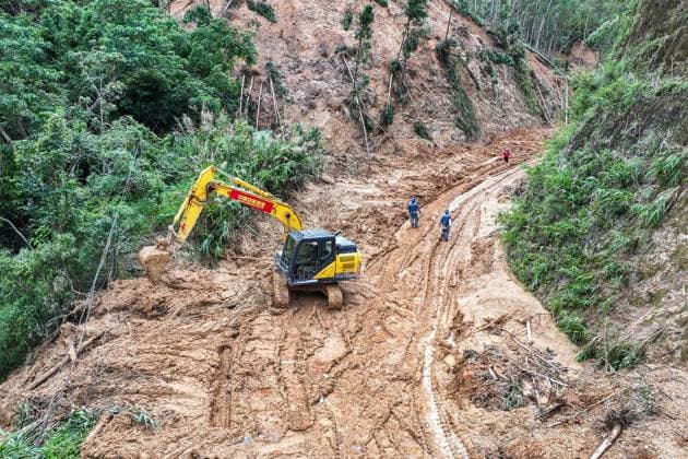 (260711) -- HENGZHOU, July 11, 2026 -- An aerial drone photo taken on July 11, 2026 shows rescuers clearing up a road leading to Zhenlong Township in Hengzhou, south China s Guangxi Zhuang Autonomous Region. One main road leading to the government seat of Zhenlong Township in the city of Hengzhou, south China s Guangxi Zhuang Autonomous Region, was preliminarily opened to traffic at around 1:30 p.m. on Saturday, Xinhua reporters at the rescue site have confirmed. With a permanent population of about 8,000, the township had been trapped as an isolated island. Hit by continuous heavy rainfall, the entire township was cut off from outside access with no open roads, power or network services starting from July 5. The opening of the mai 