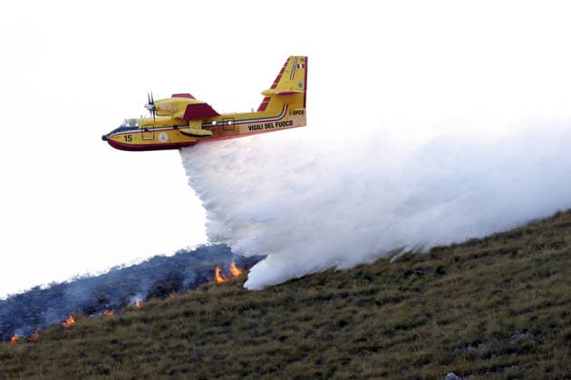 Firefighters battle wildfires in western and southern Sicily SICILY, ITALY - JULY 11: A firefighting plane drops water to control wildfires in maquis areas across the western and southern parts of Sicily, Italy on July 11, 2026. Following initial overnight responses by ground crews with water tenders, helicopters and firefighting aircraft launched aerial operations at sunrise to bring the wind-driven fires under control. Alberto Lo Bianco Anadolu Sicily Italy. Editorial use only. Please get in touch for any other usage.  Copyright: x2026xAnadoluxAlbertoxLoxBiancox