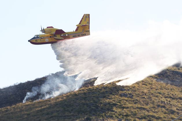 Firefighters battle wildfires in western and southern Sicily SICILY, ITALY - JULY 11: A firefighting plane drops water to control wildfires in maquis areas across the western and southern parts of Sicily, Italy on July 11, 2026. Following initial overnight responses by ground crews with water tenders, helicopters and firefighting aircraft launched aerial operations at sunrise to bring the wind-driven fires under control. Alberto Lo Bianco Anadolu Sicily Italy. Editorial use only. Please get in touch for any other usage.  Copyright: x2026xAnadoluxAlbertoxLoxBiancox