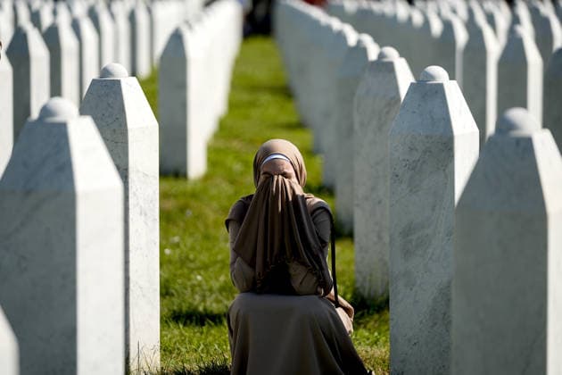 Thousands gather in Srebrenica to mark 31st anniversary of genocide as 10 more victims laid to rest POTOCARI, BOSNIA AND HERZEGOVINA - JULY 11: A woman is crying among the gravestones as relatives of victims of the 1995 Srebrenica genocide pray at the graves of their loved ones at the Potocari Memorial Cemetery in Potocari, Bosnia and Herzegovina, on July 11, 2026. Thousands of mourners, survivors, foreign dignitaries and religious leaders gathered Saturday at the Srebrenica-Potocari Memorial Center to mark the 31st anniversary of the Srebrenica genocide as the remains of 10 newly identified victims were laid to rest. The collective funeral, held every July 11, remains one of Bosnia and Herzegovina’s most solemn commemorations, as families  Copyright: x2026xAnadoluxSamirxJordamovicx