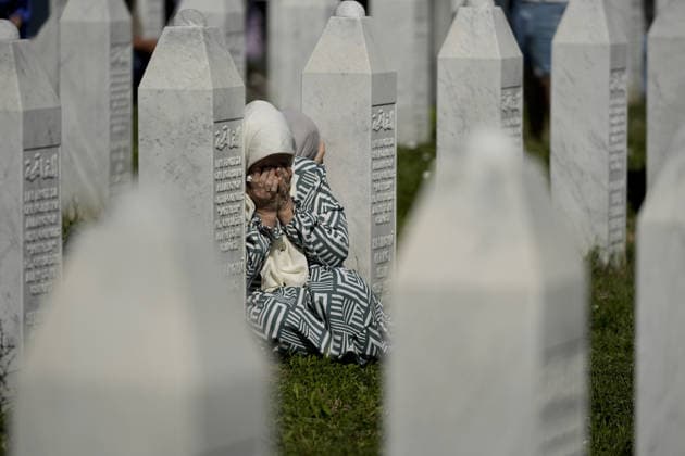 Thousands gather in Srebrenica to mark 31st anniversary of genocide as 10 more victims laid to rest POTOCARI, BOSNIA AND HERZEGOVINA - JULY 11: Relatives of victims of the 1995 Srebrenica genocide pray at the graves of their loved ones at the Potocari Memorial Cemetery in Potocari, Bosnia and Herzegovina, on July 11, 2026. Thousands of mourners, survivors, foreign dignitaries and religious leaders gathered Saturday at the Srebrenica-Potocari Memorial Center to mark the 31st anniversary of the Srebrenica genocide as the remains of 10 newly identified victims were laid to rest. The collective funeral, held every July 11, remains one of Bosnia and Herzegovina’s most solemn commemorations, as families continue burying loved ones whose remains a  Copyright: x2026xAnadoluxSamirxJordamovicx