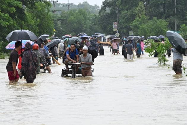 July 11, 2026, Satkania, Chattogram, Bangladesh: July 11, 2026, Satkania, Chattogram, Bangladesh: Residents use carts and boats to cross flooded roads as severe floods and landslides hit Chattogram Division. At least 39 people have died and more than 928,000 are affected across five districts. Thousands remain stranded amid shortages of food, safe water and medicines as rescue and relief operations continue. Satkania Bangladesh - ZUMAh178 20260711_zip_h178_011 Copyright: xMuhammadxAmdadxHossainx