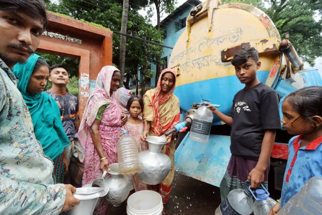 July 11, 2026, Dhaka, Dhaka, Bangladesh: 11 julay,2026, Dhaka Bangladesh:The humanitarian situation in the flood-affected areas is deteriorating rapidly. With homes inundated and cooking facilities rendered unusable, thousands of families are relying on dry food supplies, which are becoming increasingly scarce. The most critical concern, however, is the severe shortage of safe drinking water. Limited access to clean water has significantly heightened the risk of waterborne diseases, including diarrhea, dysentery, and other infectious illnesses...Meanwhile, major roads in Bandarban town, along with numerous key highways and rural roads across the district, remain submerged under floodwaters. With road transportation severely disrupted, boats - ZUMAh197 20260711_zip_h197_010 Copyright: xAzmalxHoqxHelalx