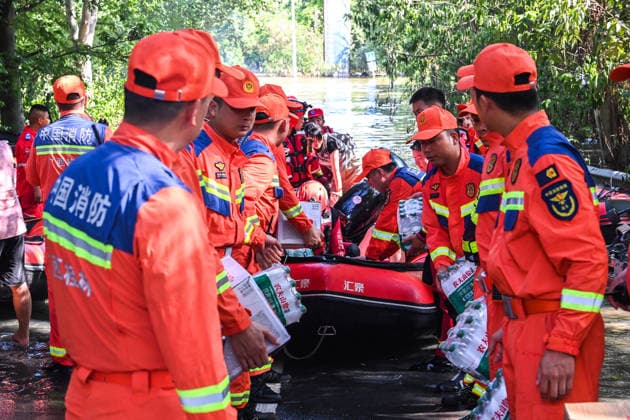 (260711) -- NANNING, July 11, 2026 -- Rescuers transport supplies in Guigang, south China s Guangxi Zhuang Autonomous Region, July 10, 2026. Triggered by Typhoon Maysak, the tenth typhoon of the year, heavy downpours battered multiple areas in south China s Guangxi Zhuang Autonomous Region, resulting in a series of disasters. Various response forces have pooled their efforts, carrying out operations including rescue missions in remote mountainous areas, restoration of transport and power infrastructure, and silt clearing operations. ) CHINA-GUANGXI-TYPHOON-FLOOD-RESCUE (CN) CaoxYiming 