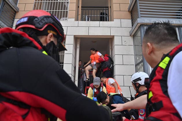 (260711) -- NANNING, July 11, 2026 -- Rescuers evacuate stranded teachers at Xijiang education park in Guigang, south China s Guangxi Zhuang Autonomous Region, July 8, 2026. Triggered by Typhoon Maysak, the tenth typhoon of the year, heavy downpours battered multiple areas in south China s Guangxi Zhuang Autonomous Region, resulting in a series of disasters. Various response forces have pooled their efforts, carrying out operations including rescue missions in remote mountainous areas, restoration of transport and power infrastructure, and silt clearing operations. ) CHINA-GUANGXI-TYPHOON-FLOOD-RESCUE (CN) ZhouxHua 