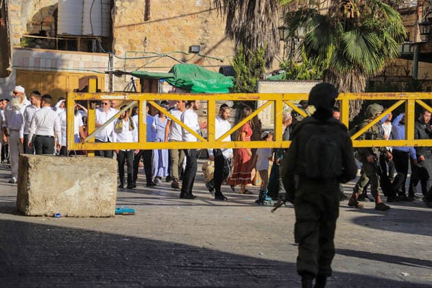 Israeli settlers under army protection raid Old City of Hebron in West Bank HEBRON, WEST BANK, PALESTINE - JULY 11: Israeli forces block entry and exit points with iron barricades to restrict the movement of Palestinians as Israeli settlers, escorted by Israeli forces, raid the Old City area of Hebron in the southern West Bank, Palestine on July 11, 2026. Amer Shallodi Anadolu Hebron West Bank. Editorial use only. Please get in touch for any other usage.  Copyright: x2026xAnadoluxAmerxShallodix